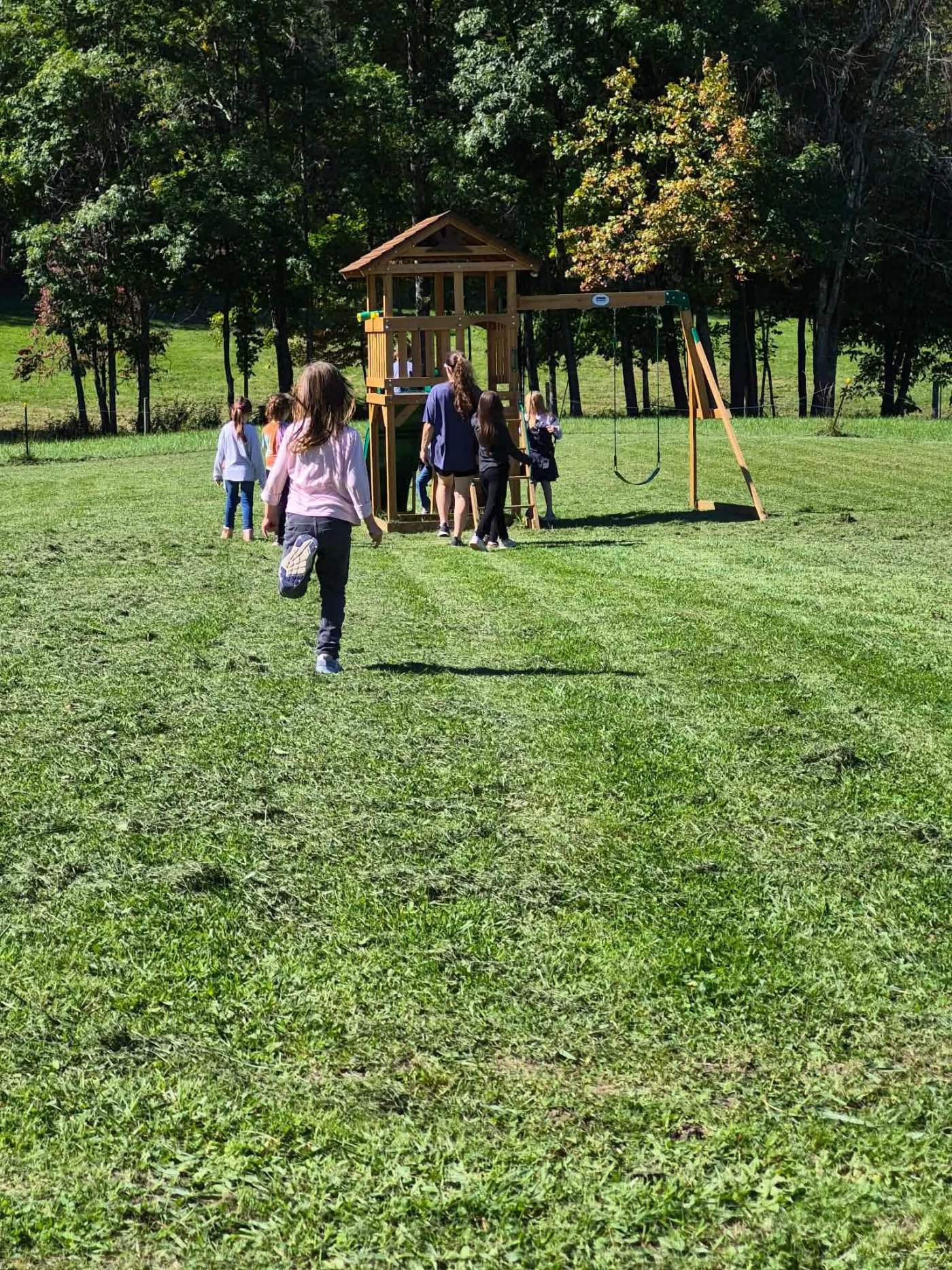 Students running toward the playground